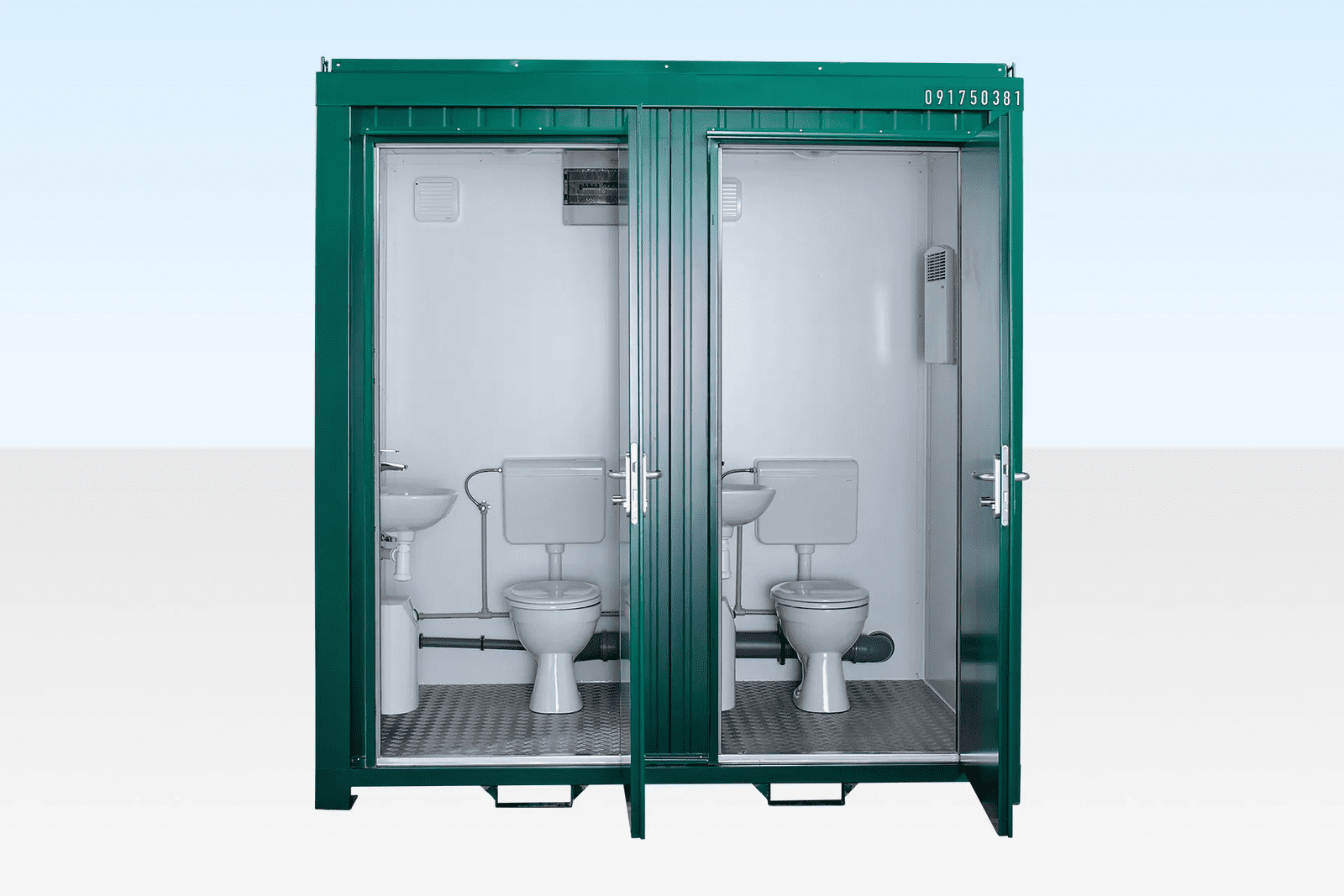 Green 11 double mains toilet unit with two doors, ready for use at a construction site.
