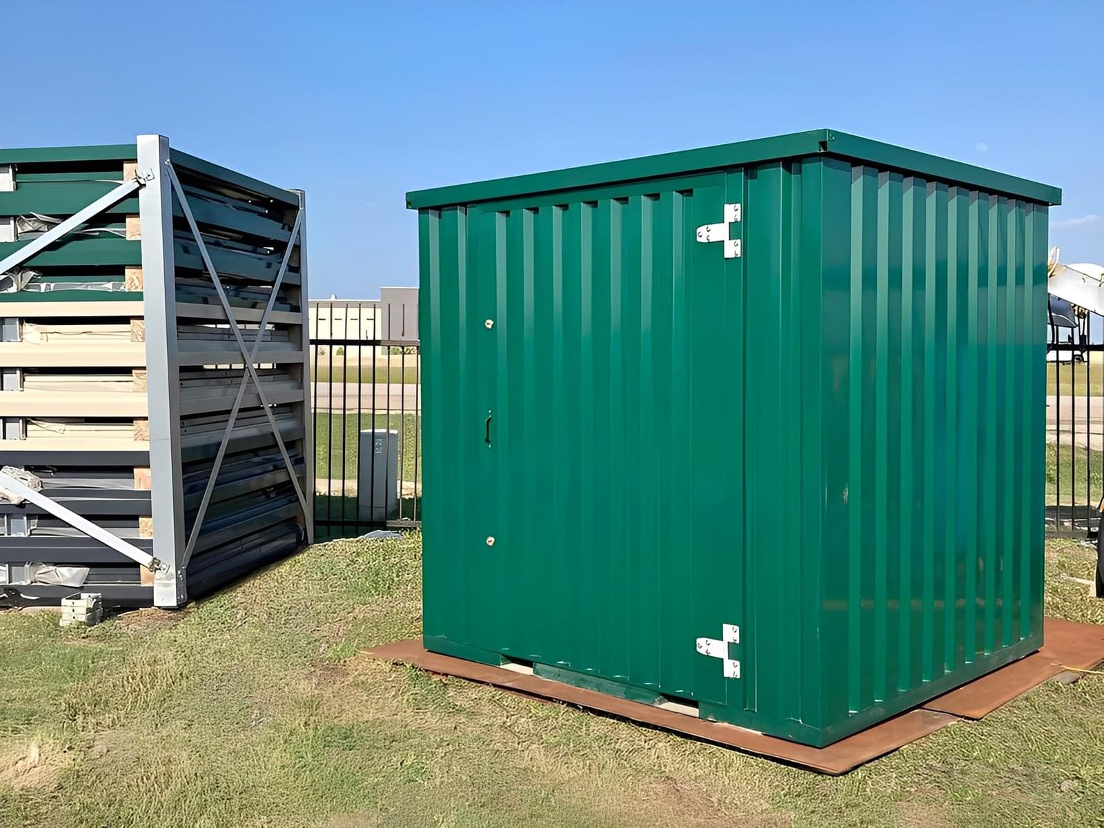 A fully assembled powder coated flat packed 6.5m office container with two windows and a door, set in an outdoor environment.
