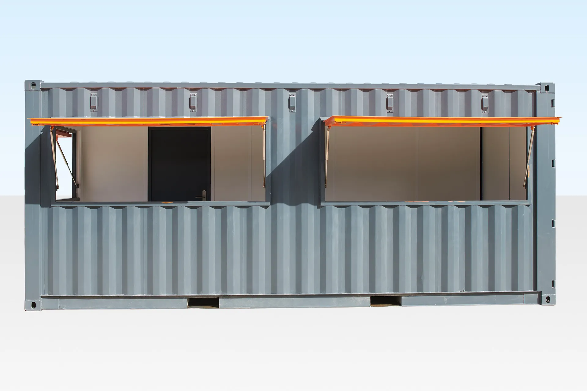 A modern 20ft shipping container cafe with a serving window and outdoor seating, ready for business.